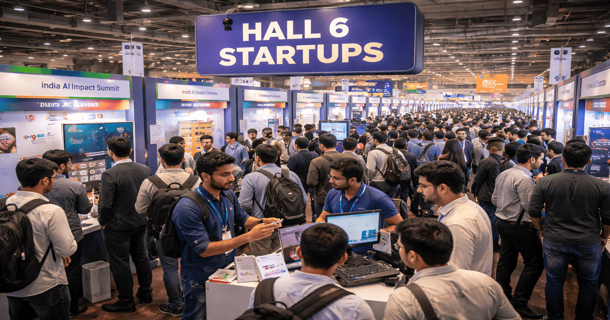Startup founder demonstrating a multilingual voice AI agent at a Hall 6 pod during India AI Impact Summit 2026, highlighting conversational voice workflows and Indian language adoption